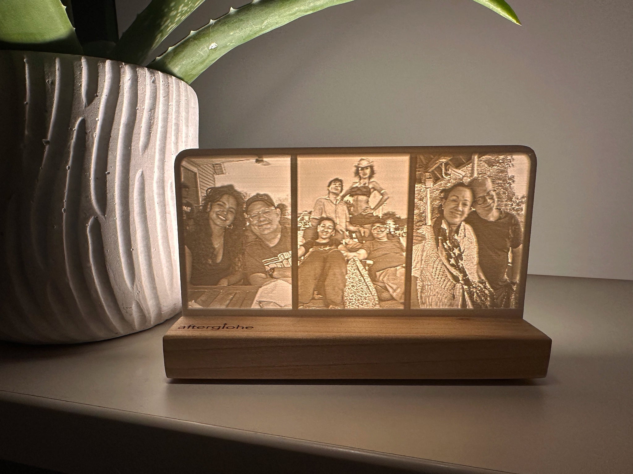 StoryLine-Mini Personalized Photo Display illuminated by an LED showing memories of a family at their beach house.