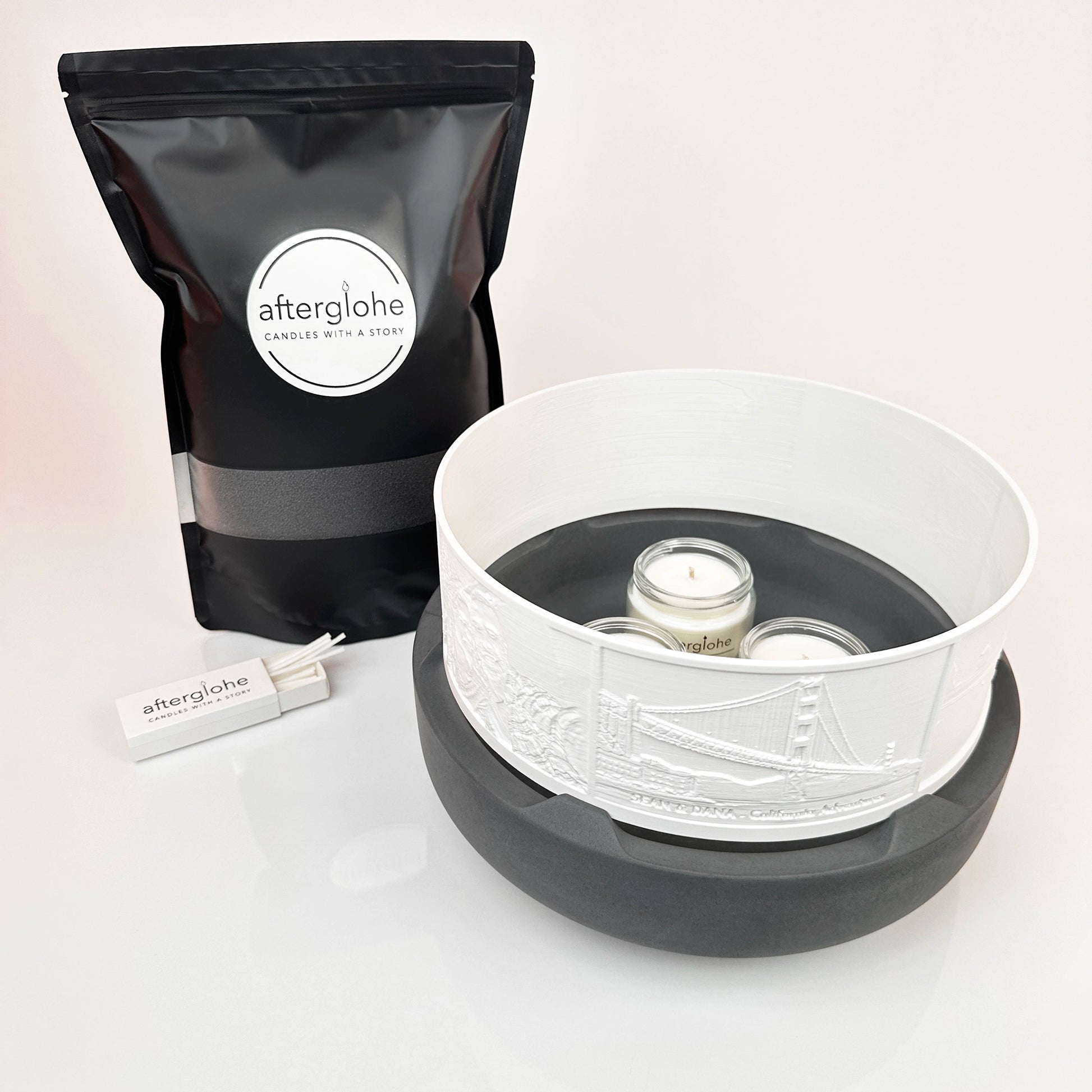 Halo Grande personalized photo display with River Granite concrete base, Midnight Black Sand Wax and wicks, and three scented candles