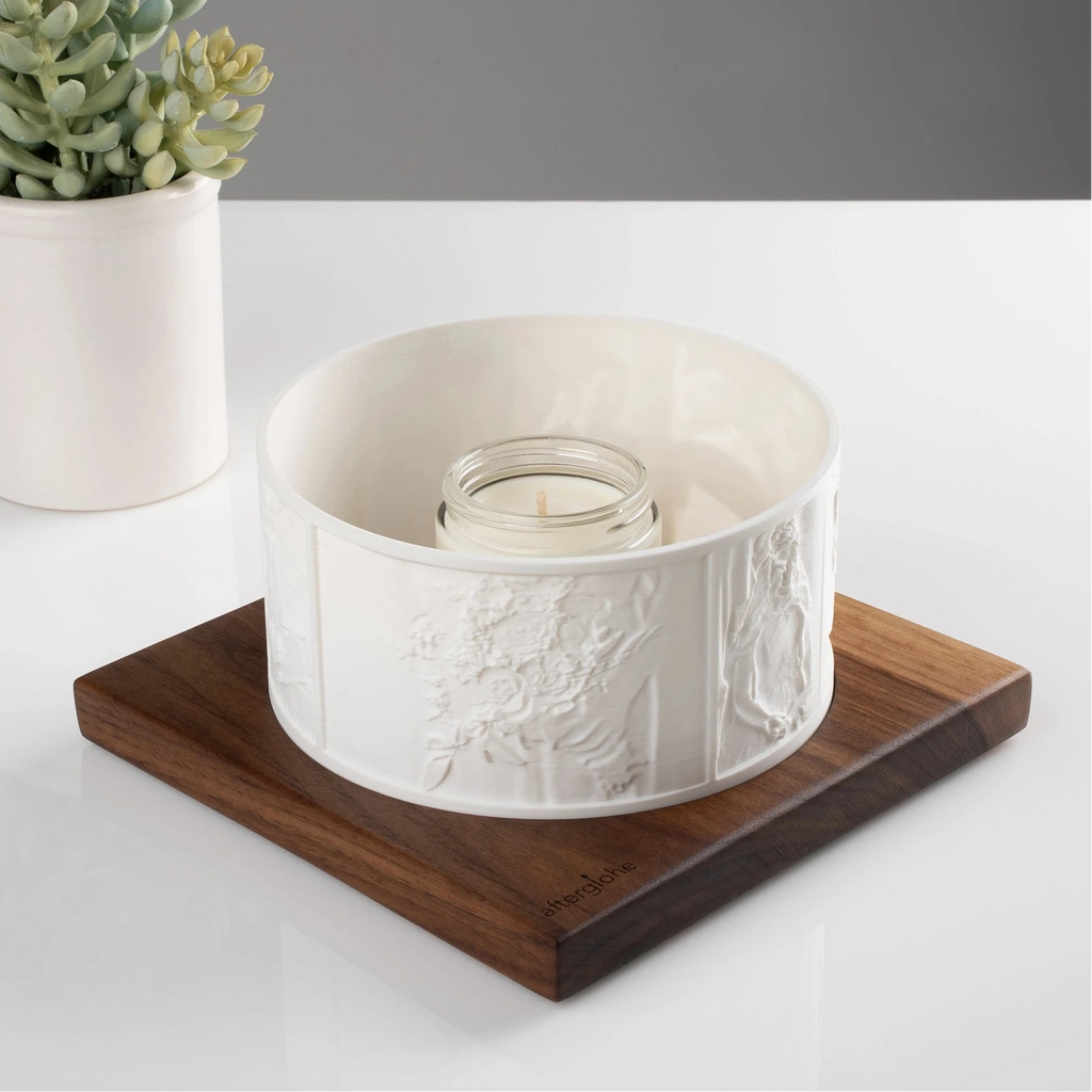 Halo personalized photo display on walnut base with candlelight and succulent in background