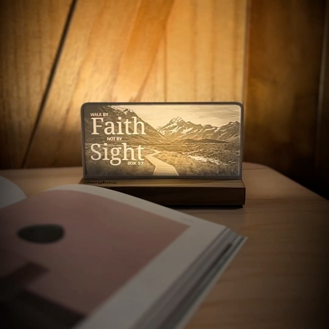 StoryLine-Mini lithophane photo display lit with Warm LED featuring a mountain scene and encouraging Bible verse rotating on a small table