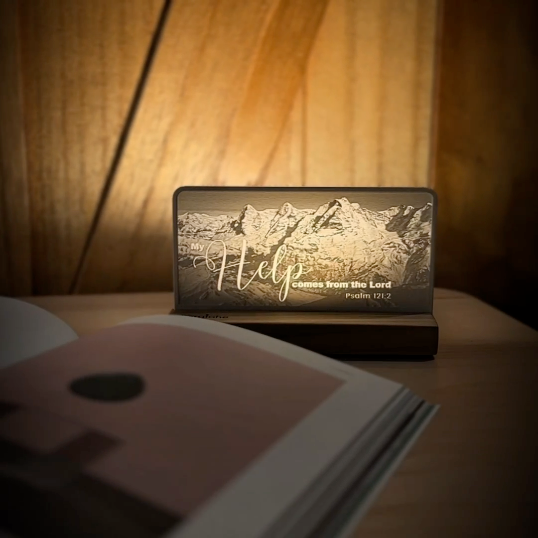 StoryLine-Mini lithophane photo display lit with Warm LED featuring a mountain scene and encouraging Bible verse rotating on a small table