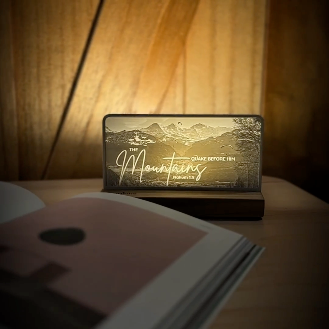 StoryLine-Mini lithophane photo display lit with Warm LED featuring a mountain scene and encouraging Bible verse rotating on a small table
